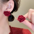 Macro shot of 14k gold-plated red flocked flower earrings on model highlighting texture - 10# Silver Needle - Red Flocked Flower Stud