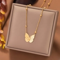 Elegant gold butterfly pendant necklace with beaded chain on jewelry display box - Butterfly (AH1198) / Gold
