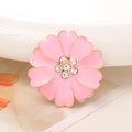 Macro shot of a pink enamel flower brooch with gold edges and sparkling rhinestones - Rhinestone Center Flower / Pink
