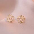 Detailed close-up of clover flower stud earrings with pink and white cubic zirconia - Gold Pink Rotating Earrings (E0885)