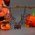 Detail of Halloween spider web earrings with red rhinestones hanging on a dry branch - Bright Black Spider Web Style (WG-0250)