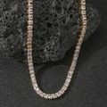 Macro shot of gold tennis necklace with square zircons on black volcanic rock base - Single Necklace / Gold Necklace