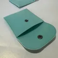 Macro detail of mint green velvet jewelry pouch with silver metal snap button closure - 8*8cm / Sky Blue