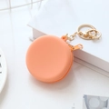 Mini orange round silicone coin purse with gold keychain and zipper closure - Orange