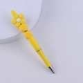 Detail of yellow flower silicone beaded pen with silver metal tip on a white plate - Yellow