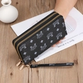 Detail of black double-zipper long wallet with wrist strap and gold-tone hardware detail - SLW-205 Black