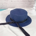 Detailed texture of navy straw hat with a black and white polka dot ribbon bow decoration - M (56-58cm) / Navy Blue