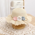 Detailed view of children straw hat with three delicate floral decorations and wavy lace brim - Straw Hat / Beige / 52cm (2-5 Years)