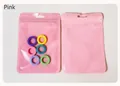 Pink holographic resealable bag with hanging hole showcasing colorful plastic ring accessories - Pink