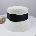 Detailed top-down shot of white woven straw sun hat with classic wide black ribbon decoration - M (56-58cm) Adjustable / White