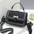 Fashionable black macaron handbag with white contrast stitching and wide embroidery strap - Black