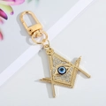 Golden Freemason key ring featuring a blue evil eye pendant with sparkling rhinestones - Gold Masonic Eye 8