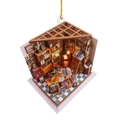 Macro detail of miniature bookstore ornament with cozy bookshelf and warm lighting - Triangular Library