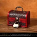 Vintage wooden jewelry box with floral texture and bronze-tone combination lock - Floral Handle + Combination Lock