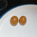 Macro shot of oval brown resin stud earrings with glossy finish on a ceramic tray - Gold Brown-Stud Style (28#)