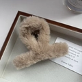 Detailed view of a soft beige plush hair claw clip resting on a minimalist wooden tray - 8cmx5cm / Khaki