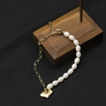 Elegant natural pearl bracelet with golden chain and heart charm on jewelry stand - Asymmetric Heart Pendant Spliced Freshwater Pearl Bracelet