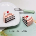 Macro shot of 1.4cm miniature resin sandwich cake with pink cream and cherry detail - Coffee Cream Triangle