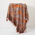 Orange paisley print satin silk scarf with vintage ethnic patterns on a white pedestal - Paisley Orange