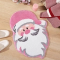 Detail of Santa Claus shaped plush rug in pink and white for festive bathroom decor - Christmas Style 6