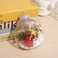 Transparent Christmas ball ornament filled with red pom poms and green pine branches - Style C (Red Pompoms & Gold Stars)