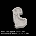 Grey silicone mold of a dapper puppy with a bowtie for DIY soap and candle making - Small / Gray
