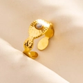 Detail of hammered gold adjustable ring with central white oval stone on soft fabric - Gold White Gemstone Style (J514-G-W)