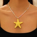 Colorful beaded necklace with a yellow starfish pendant worn for a summer beach look - Colorful Seed Beads Yellow Starfish Short Necklace (KG-375)
