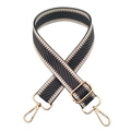 Macro view of dark grey and beige herringbone strap with gold metal hooks and buckle - Dark Gray