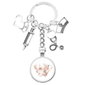 Silver medical keychain with nurse hat, stethoscope charms and pelvic anatomy glass dome - Anatomical Pelvis