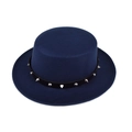 Detail of silver spiked metal rivets on black leather strap of a navy wool boater hat - M (56-58cm) / Navy Blue