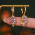 Elegant gold drop earrings with leaf-shaped purple zircon clusters on a small hoop - Purple Leaf Drop / Purple