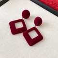 Close-up of vintage burgundy flocked square geometric earrings on textured fabric - Flocking Geometric Patchwork Square Studs