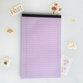 Vertical view of lavender purple legal pad with black header and lined pages - A5 / Purple