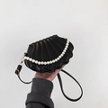Minimalist black shell-shaped crossbody bag with decorative pearl handle and gold metal hardware - Black