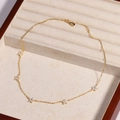 Detailed macro view of the gold flower necklace with clear zircons in a velvet jewelry box - White Flower - Gold