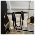 Close-up of straw woven tote bag featuring black leather handles and Summer embroidery - No Pendant / Black