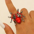 Detail of gothic spider ring with large red pear-cut crystal on black metal finish - Red Zirconia Style (1681)