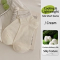 Silky cream silk blend ankle socks with ribbed cuffs for women on vintage book background - One Size / Cream