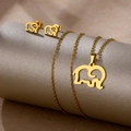 Macro view of gold elephant necklace and earrings jewelry set on a display stand - Elephant Shape (TZ-469)