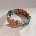 Retro multi-color elastic bracelet with daisy embossed oval beads in vintage metal finishes - Colorful