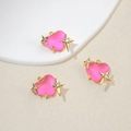 Detail of pink resin heart pendants with gold frames and star cubic zirconia accents - Deep Pink