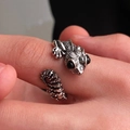 Macro detail of silver lizard wrap ring featuring realistic scale textures and black bead eyes - Lizard Style (G-377) / Antique Silver