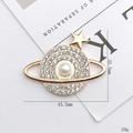 Sparkling Saturn planet brooch with rhinestones and pearl detail, 35.5mm by 43.5mm size - Gold Saturn