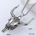 Macro shot of silver bull skull pendant on white rock, measuring 48mm by 49mm - Bull Skull Necklace (Style 10)