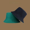 Detail of dark green and black reversible sun hats featuring UV protection fabric texture - M (56-58cm) / Green & Black