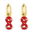 Macro detail of gold-plated infinity earrings with red enamel and zircon stones - Red