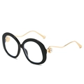 Fashion round sunglasses with black frames, gold wavy metal temples and pearl accents - Black Frame Clear Lenses