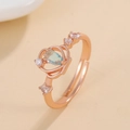 Rose gold adjustable ring featuring pear-cut light blue zircon and dainty crown setting - Rose Gold Teardrop Blue Zirconia Ring (X796) / Light Blue