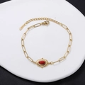Golden stainless steel chain bracelet featuring a sunburst oval red stone pendant charm - Red Oval Gemstone-Sunburst
